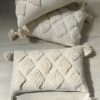 Natural tufted oblong cushion
