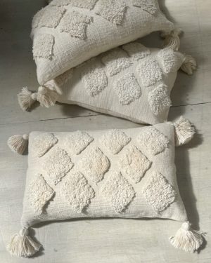 Natural tufted oblong cushion
