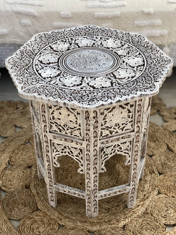 intricately carved side table