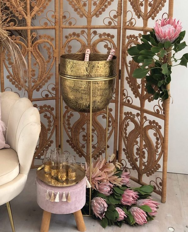 large gold ice bucket on stand